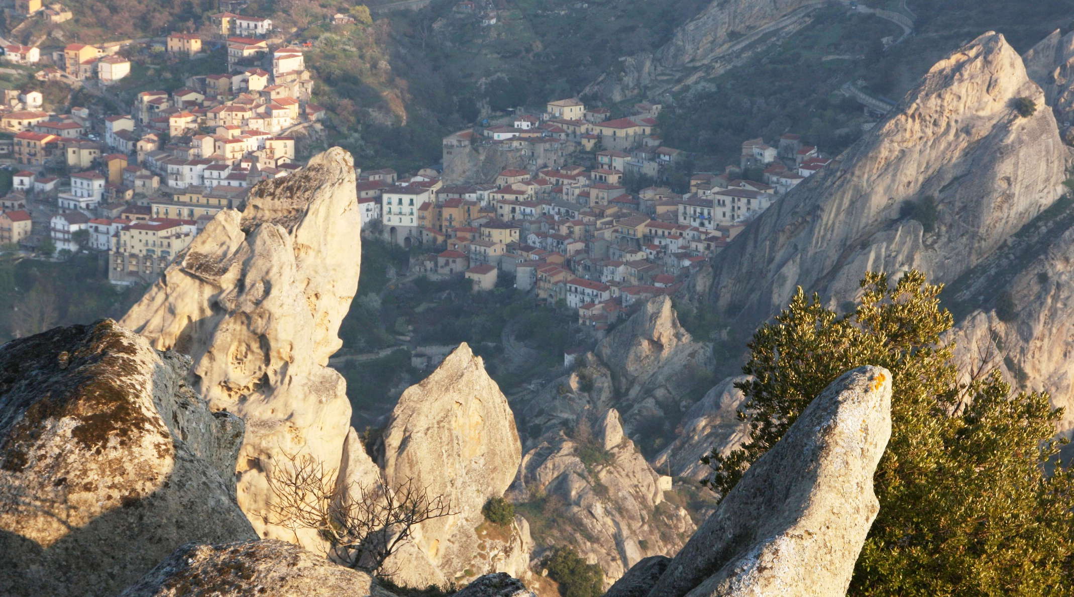 View from Pietrapertosa. The tilted and folded sandstone rocks of the Dolomiti Lucane sharply rise from the surrounding hills. Castelmezzano goes back to the 10th Century when people fled to the rugged terrain from Saracene invaders and founded the village at 750 m asl. It is considered one of the most beautiful villages in Italy. WI_e2129_010.JPG