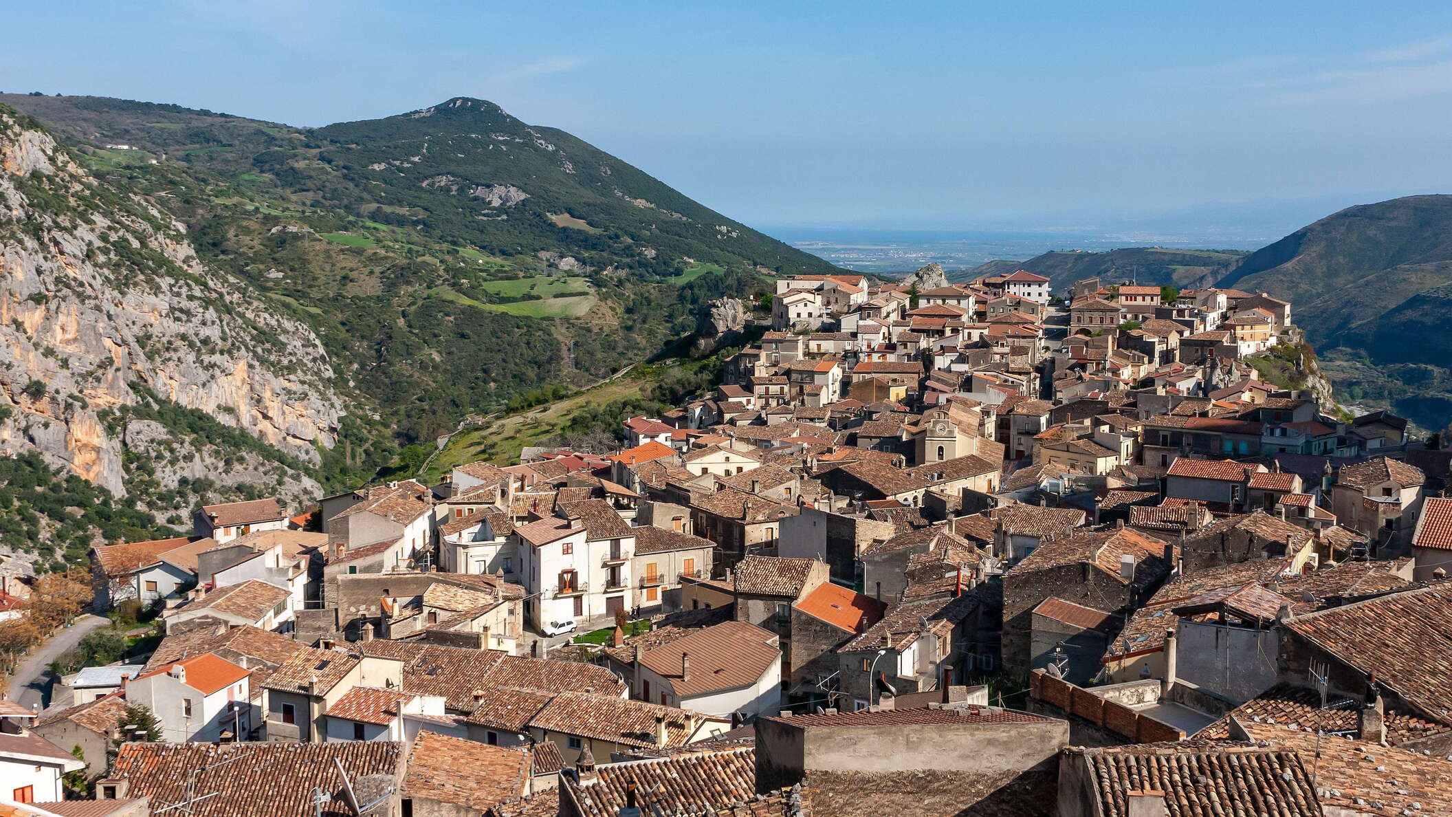 This village in Calabria was founded by the Arbëresh: they moved to southern Italy from Albania in the late 15th Century, when their home country had come under the rule of the Osman Empire. View in southeastern direction, the Ionian Sea appears in the background of the photo. WI_e2139_005.JPG