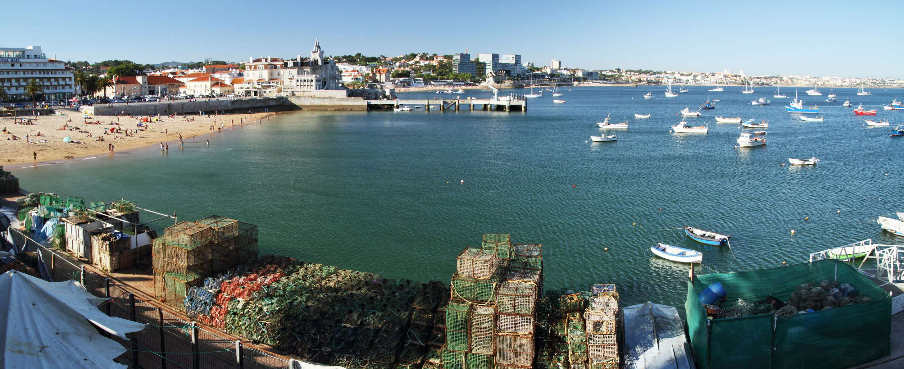 Northeastward view over one of Portugal's most famous holiday resorts, with fishing equipment in the foreground and the beach Praia da Ribeira in the left background WI_pt022.jpg