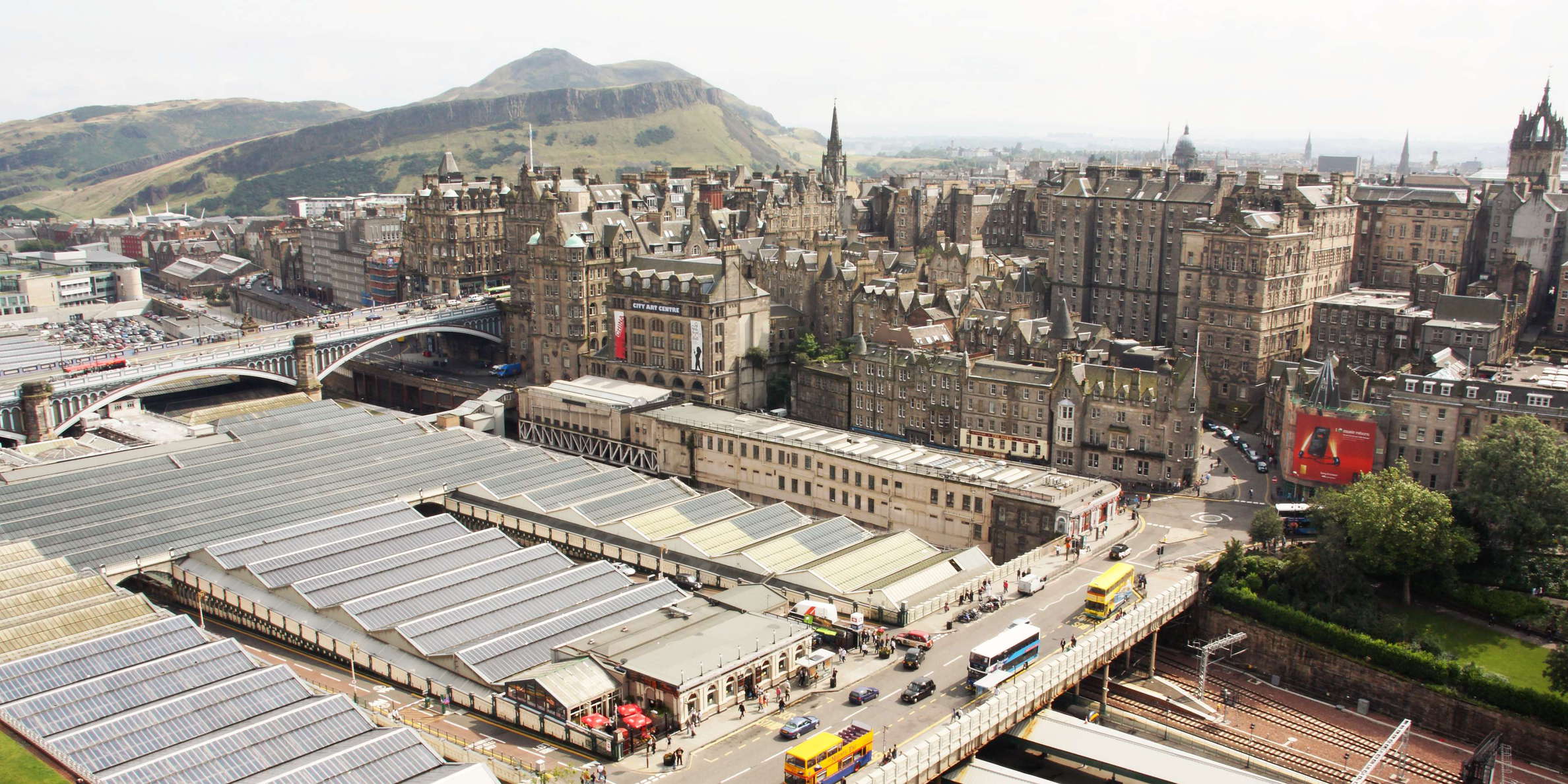 View from Scott Monument in southeastern direction over the Waverley railway station and the old town of Scotland's capital city to the extinct volcano Arthur's Seat (251 m) in the left central background WI_uks002.jpg