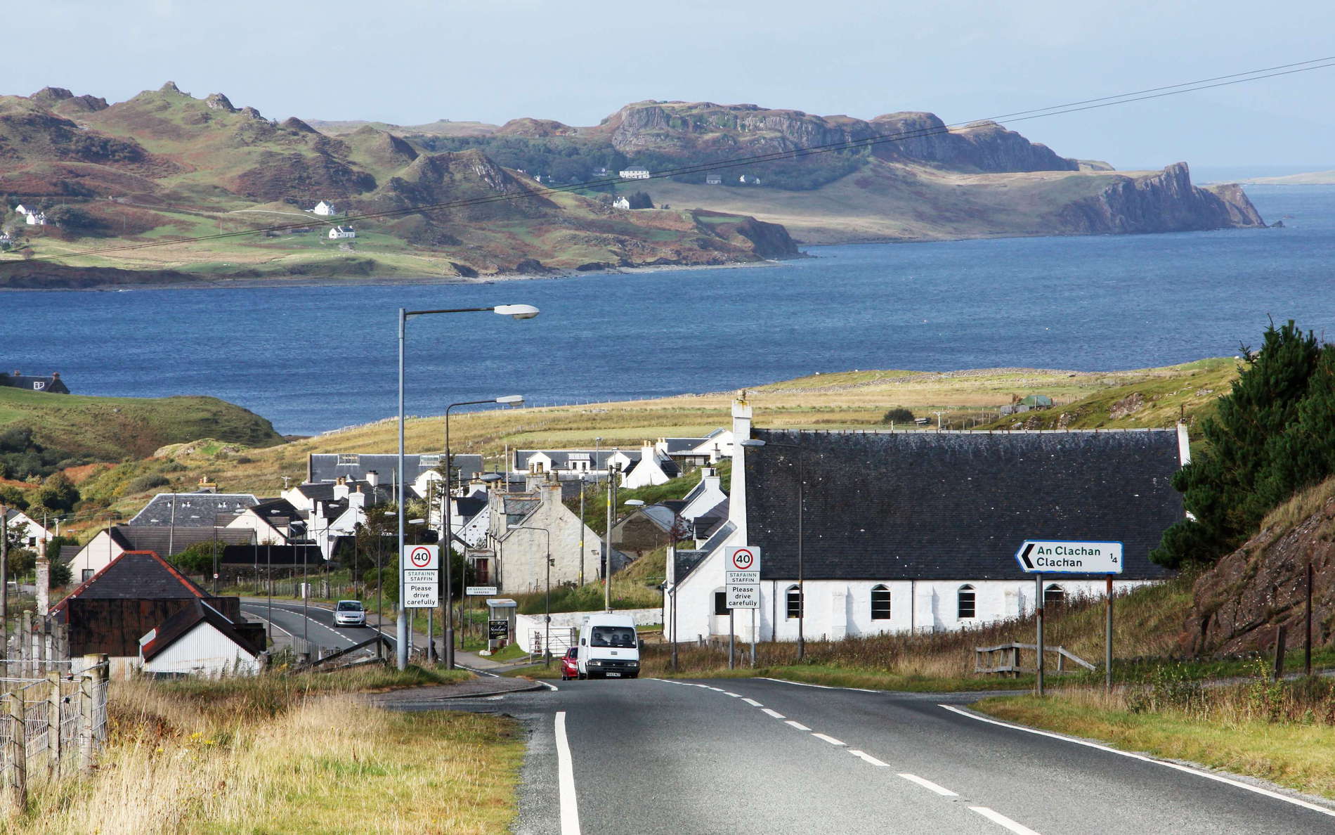 Road A855 in the foreground. View in northern direction to the Staffin Bay and to the Quiraing. The Quiraing is the only currently active part of a huge landslide area comprising the entire eastern slope of the Trotternish Peninsula. The road running through the system of ridges and valleys has to be repaired each year. WI_uks129b.jpg