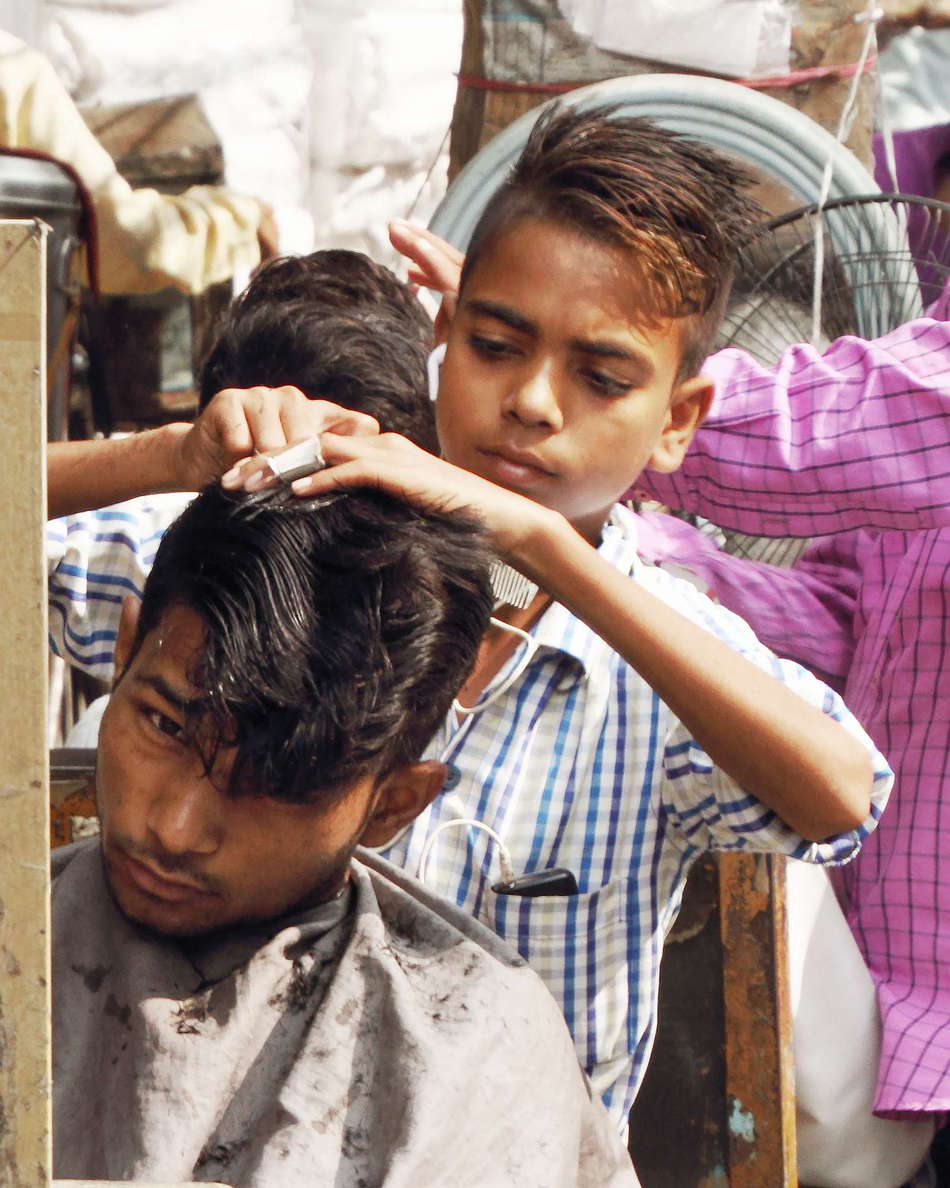 Delhi  |  Young barber at Chawri Bazar