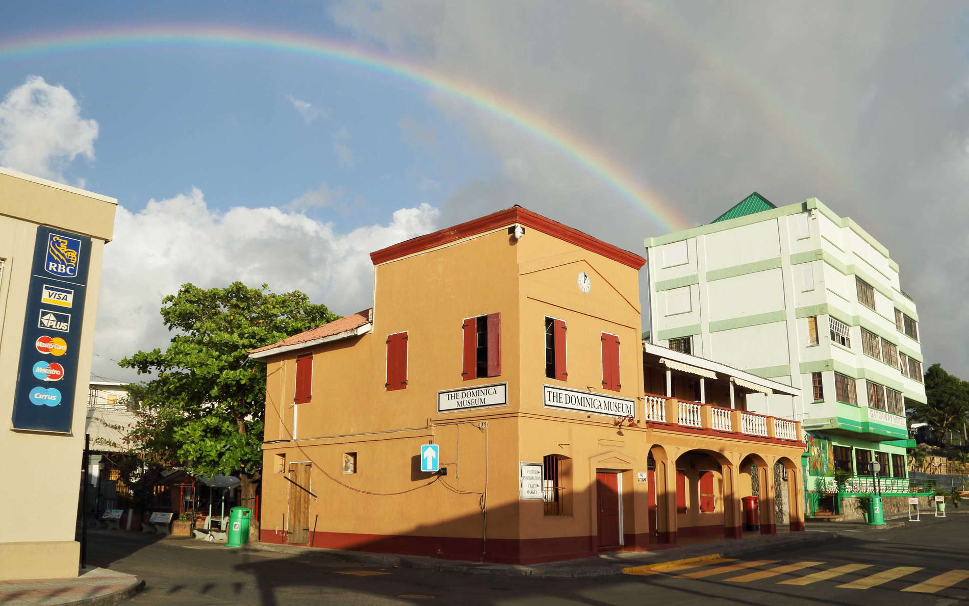 Corner of Dame Mary Eugenia Charles Boulevard and King George V Street. The rainbow indicates the changeable weather along Dominica's west coast. WI_la609.jpg