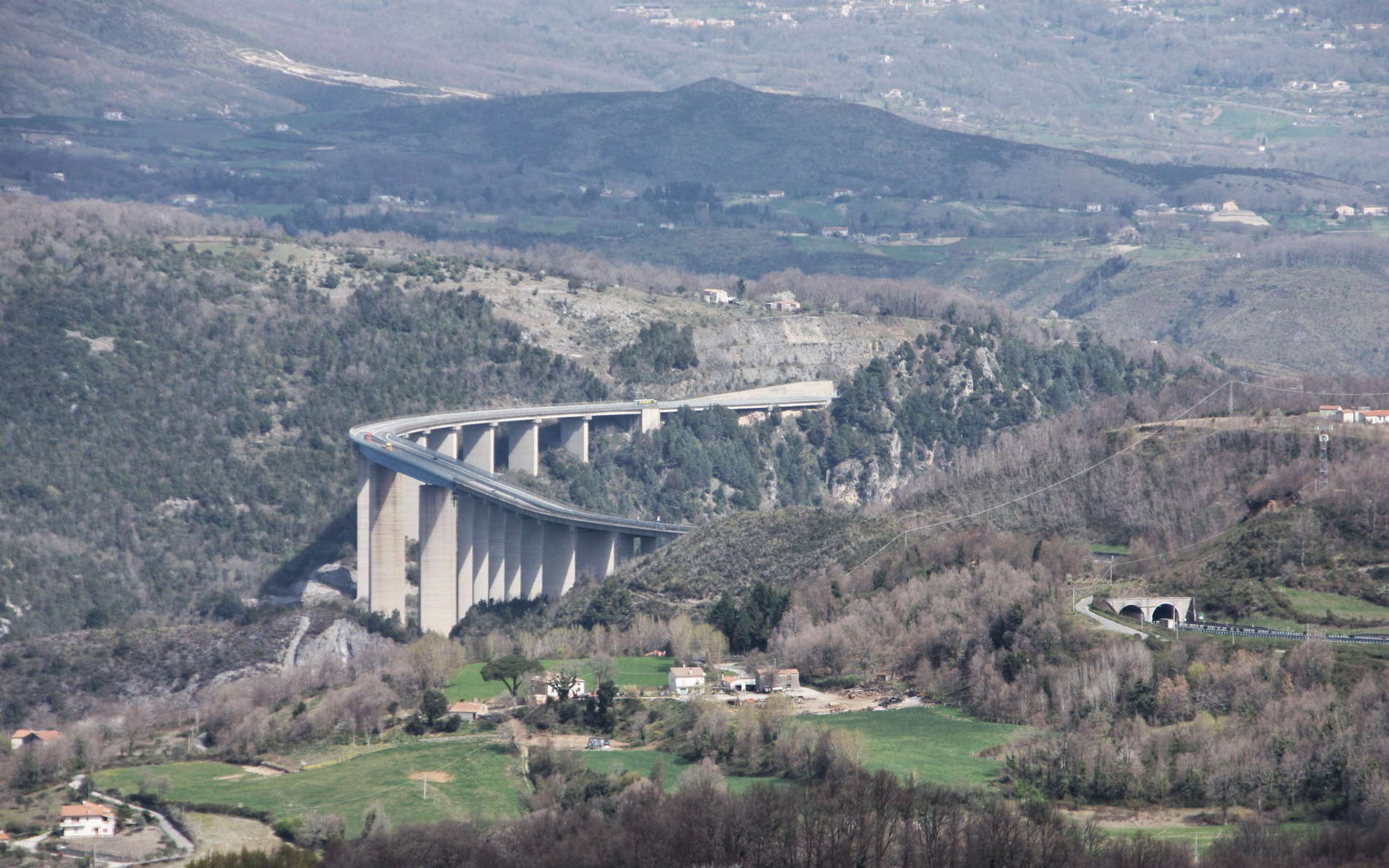 View from the National Road 504 in northwestern direction to the A2 (former A3) Motorway with Viadotto Italia in the centre of the image, crossing the Lao River at a height of 260 m. The Viadotto Italia was Europe's highest bridge until the construction of the Viaduc de Millau in southern France. WI_e2136t.JPG