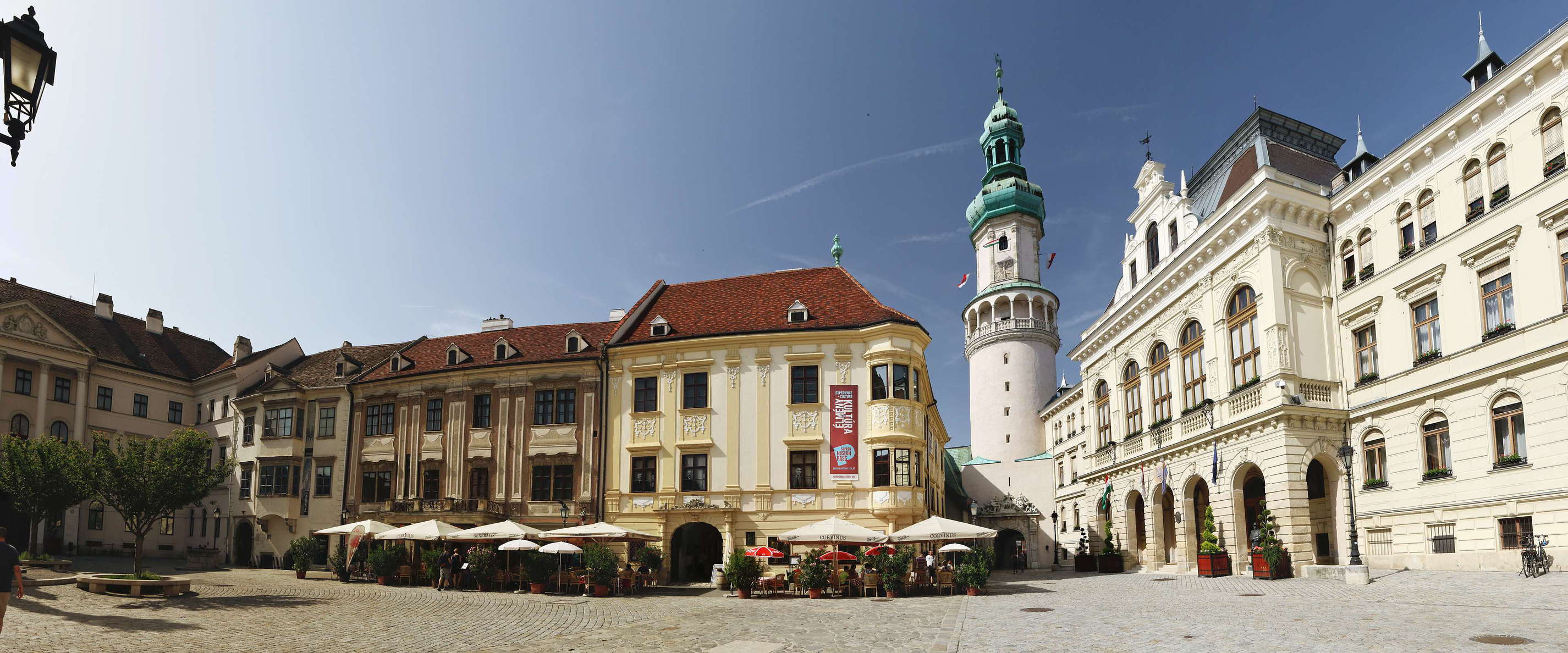 Fő tér is the main square in the historic centre of Sopron. Tűztorony (Fire Tower) served as a gate tower at the medieval town wall and as a lookout tower for the early detection of fires. The appearance of the tower itself goes back to its reconstruction after a fire in 1676. The town hall appears in the right portion of the photo. WI_hu803.jpg
