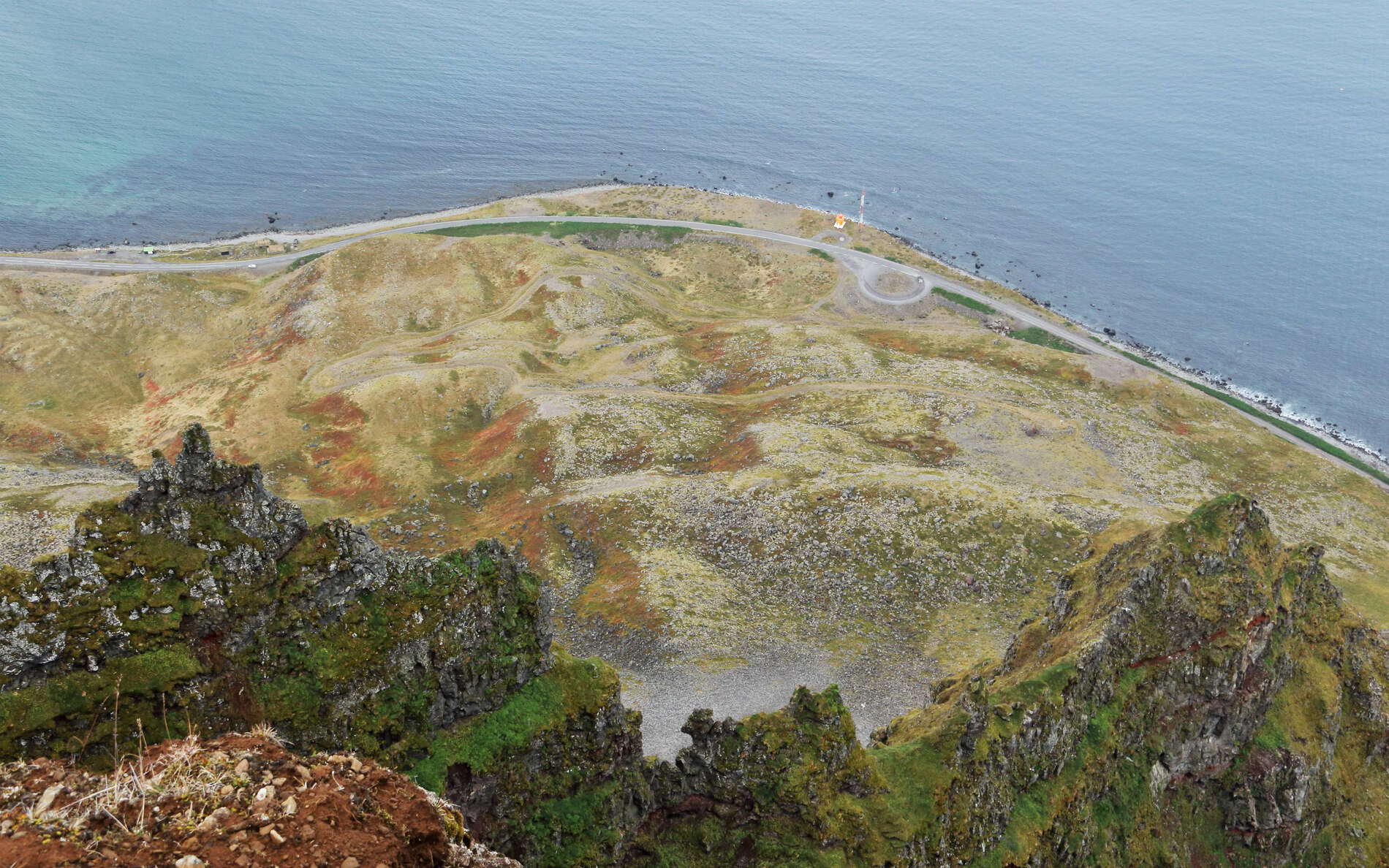 View from the summit area of Óshyrna. Its slopes are the scene of frequent landslides such as this ancient rock avalanche. The road running along the base of the mountain, connecting Ísafjörður and Bolungarvík, was heavily exposed to rock fall hazards and has therefore been replaced by a tunnel. WI_is194.jpg