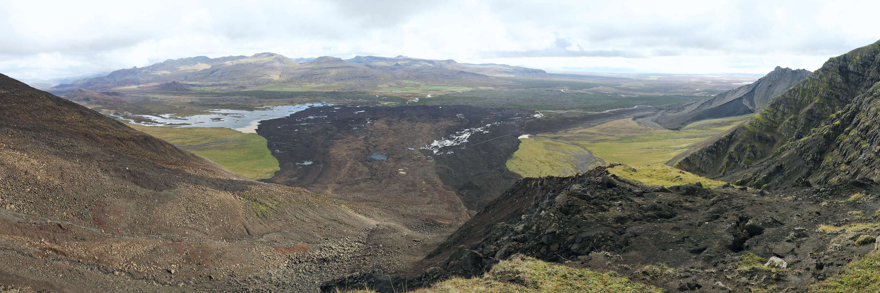 This extremely mobile rock avalanche occurred in the morning of 7 July 2018. It travelled over a distance of 2.3 km, increasing its volume from approx. 7 million to more than 10 million cubic metres. The two-colour deposit, with the brighter part in the centre, might indicate that the event occurred in two stages. Fine sediments within the deposit show that the landslide ploughed the probably water-saturated valley bottom when broadly spreading over flat terrain and blocking the river Hítará. WI_is209.jpg