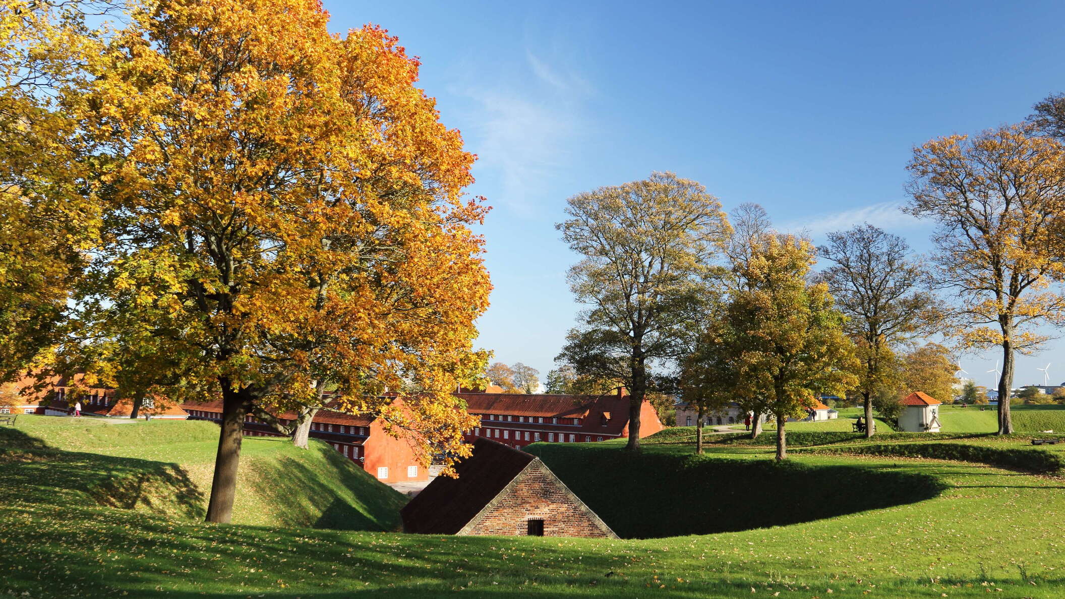 The Kastellet is one of the best-preserved citadels of N Europe. Surrounded by a moat, this pentagon-shaped estate is still in military use, but also represents an important recreational area and cultural heritage site. The building in the foreground of this image is the Powder House (Krudthuset). WI_dk558.jpg