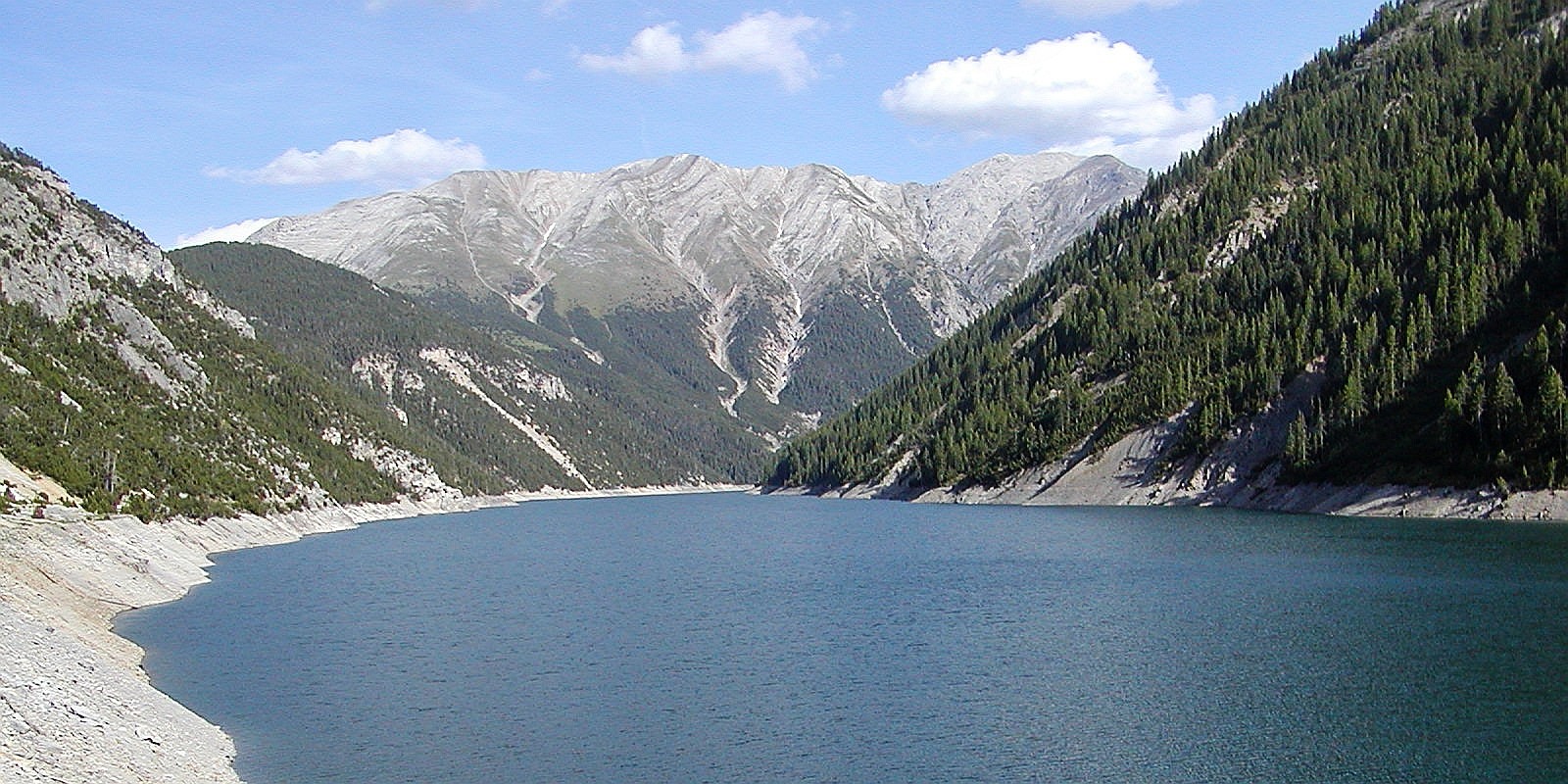 View from the 130 m high dam Punt dal Gall towards southeast. This reservoir - also known as Lago del Gallo - was completed in 1968. The left portion of the image shows Swiss territory, as the border runs along the middle of this branch of the lake. WI_e2072_101.jpg