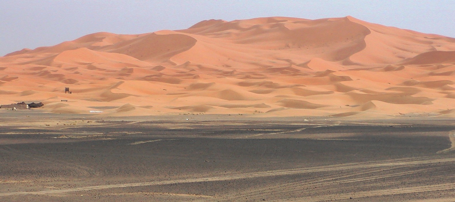 Erg Chebbi represents one of two large dune fields in the Moroccan part of the Sahara desert, with dunes reaching a maximum height of approx. 150 m. The foreground of the image shows a serir (gravel desert). WI_mc076.jpg