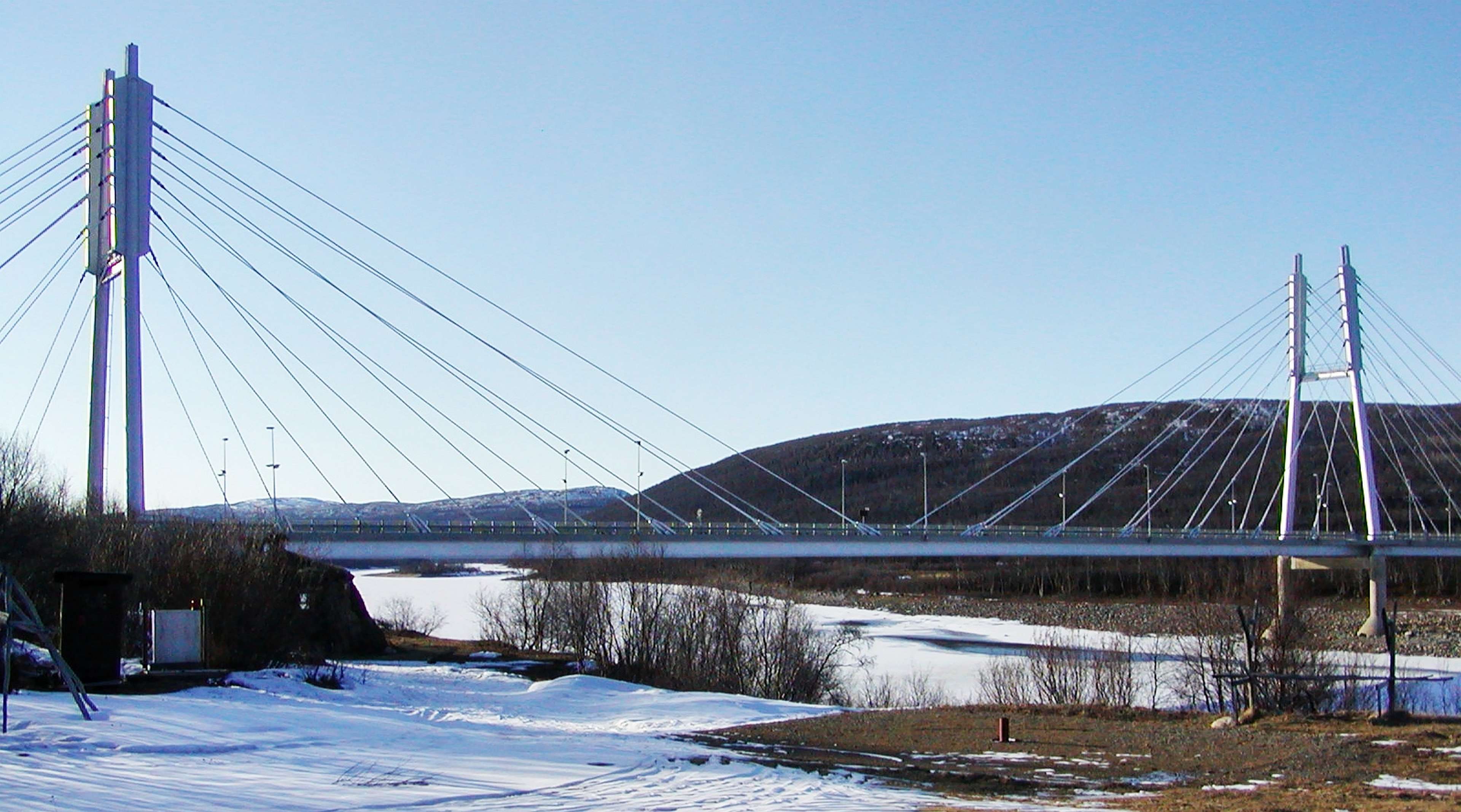 This cable-stayed bridge crosses the Tana River and thereby connects Finland (viewpoint) and Norway. It was opened in 1993. WI_fi043a.jpg